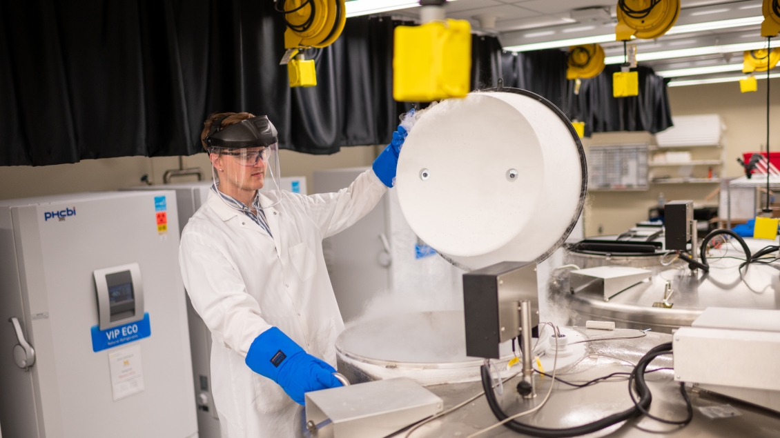 Photo of CBR staff member opening a liquid nitrogen tank