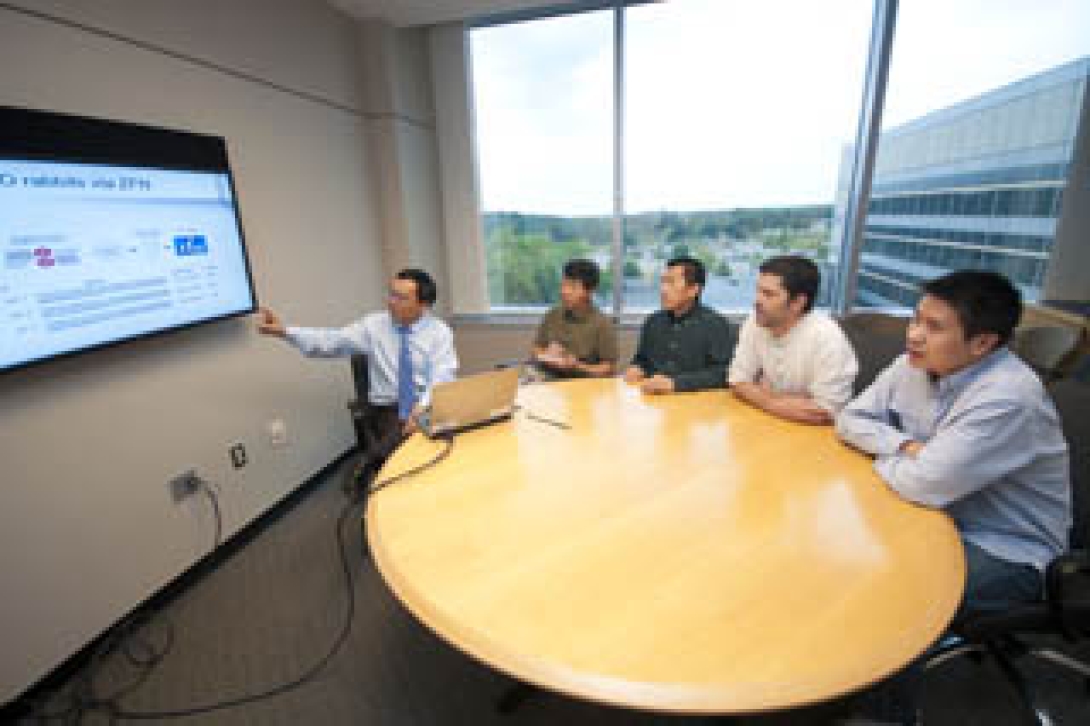 Research team around conference table