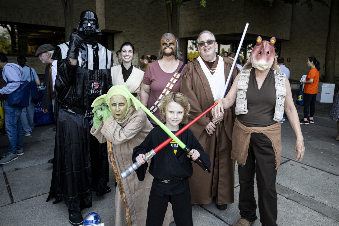 people posing in Star Wars costumes at event