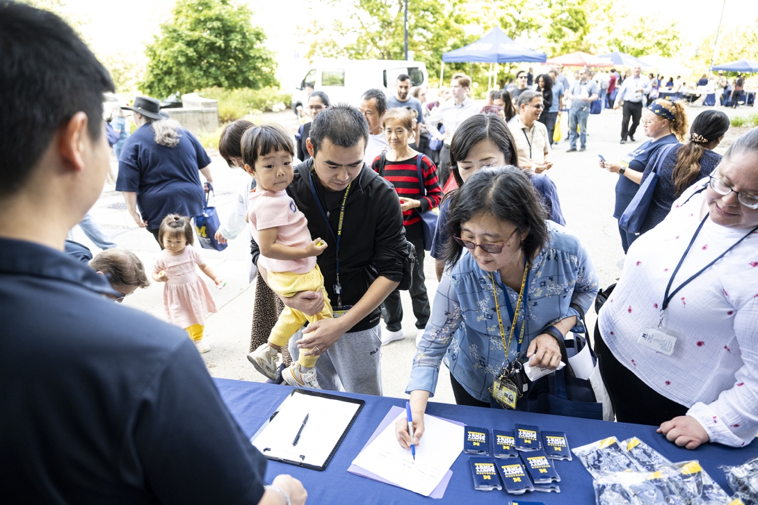 people talking at table at event