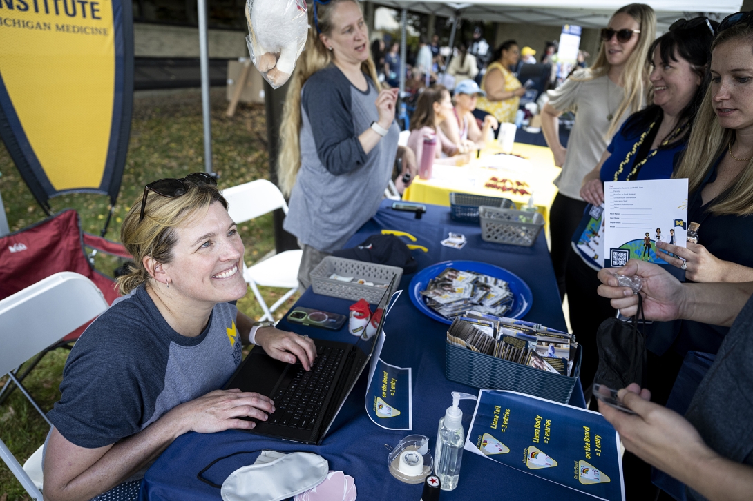 people talking at table at event